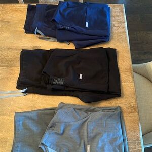 Figs scrubs, grey, black and navy blue. All size large. Selling for $40 per set.
